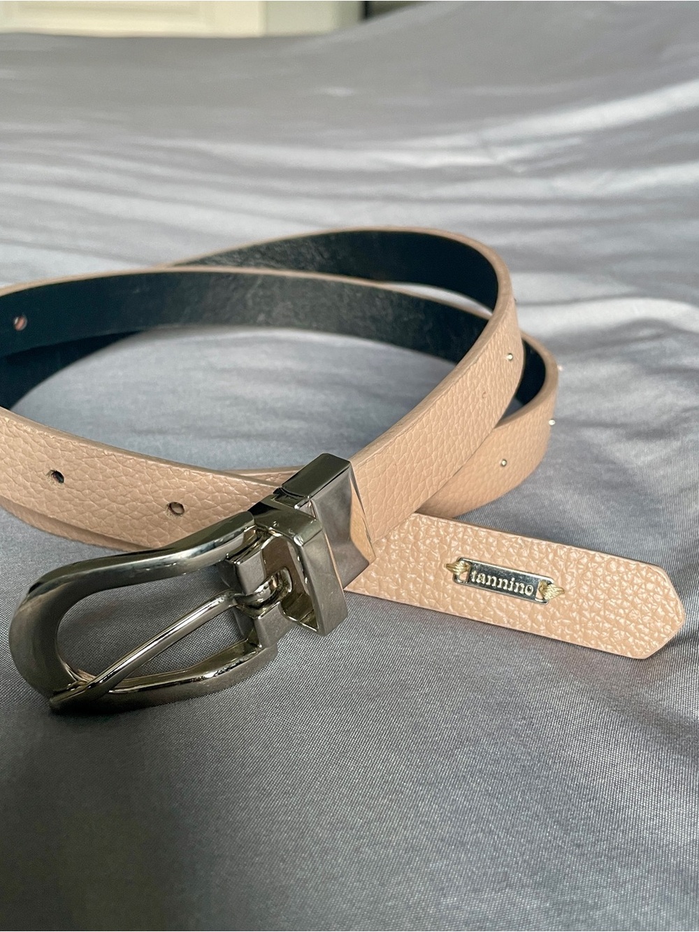 Reversible pink/black leather belt with silver buckle